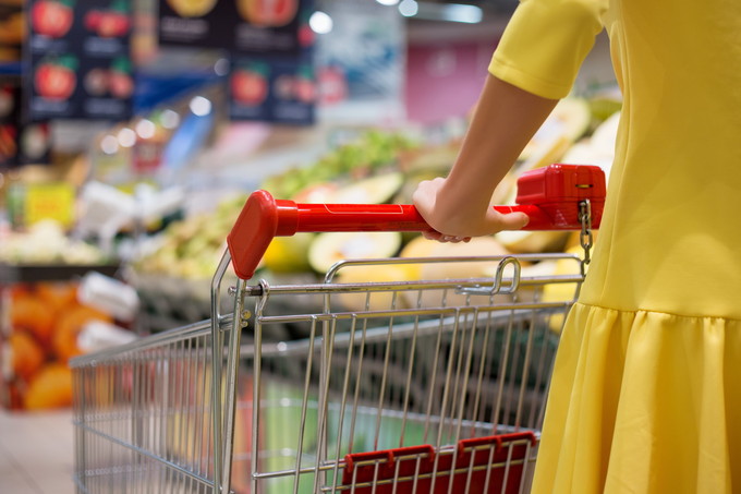 Woman shopping for groceries in supermarket